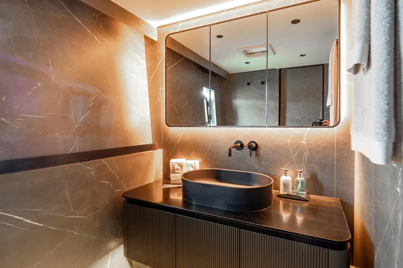 Shades Of Grey Yacht Photos Pics Luxurious bathroom in 2024 Sunreef 80 Sailing yacht with modern fixtures and elegant design.