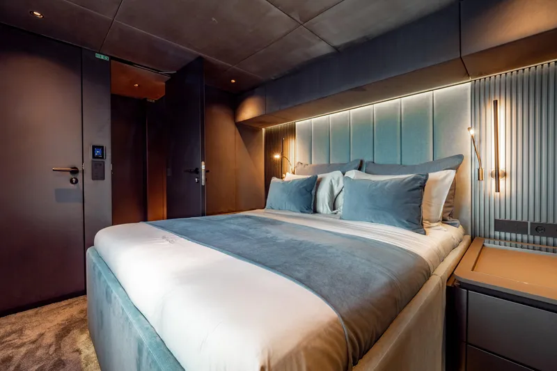 Shades Of Grey Yacht Photos Pics Luxurious bedroom interior of 2024 Sunreef 80 sailing yacht with modern design and ambient lighting.