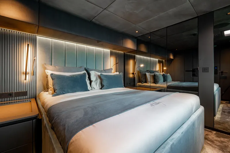 Shades Of Grey Yacht Photos Pics Luxurious bedroom interior of 2024 Sunreef 80 sailing yacht with modern design and ambient lighting.