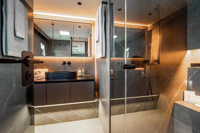 Shades Of Grey Yacht Photos Pics Luxurious bathroom interior on 2024 Sunreef 80 sailing yacht, featuring modern design and elegant fixtures.