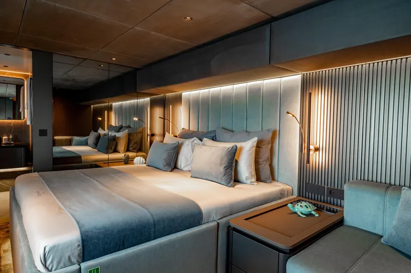 Shades Of Grey Yacht Photos Pics Luxurious bedroom interior of 2024 Sunreef 80 Sailing yacht with modern design and ambient lighting.