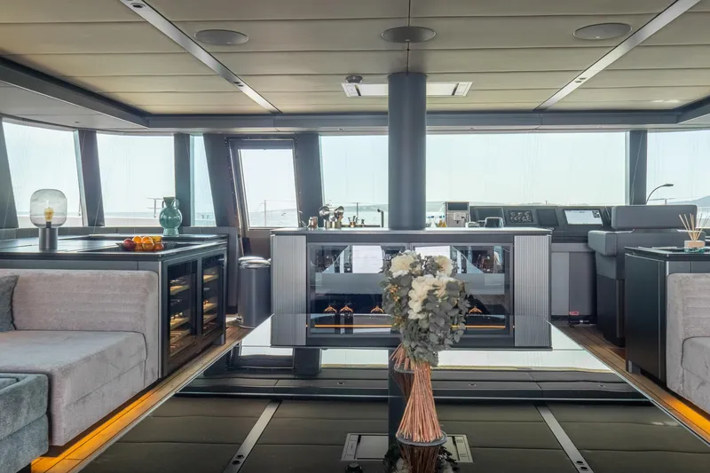 Shades Of Grey Yacht Photos Pics Luxurious interior of 2024 Sunreef 80 sailing yacht with modern design and elegant furnishings.