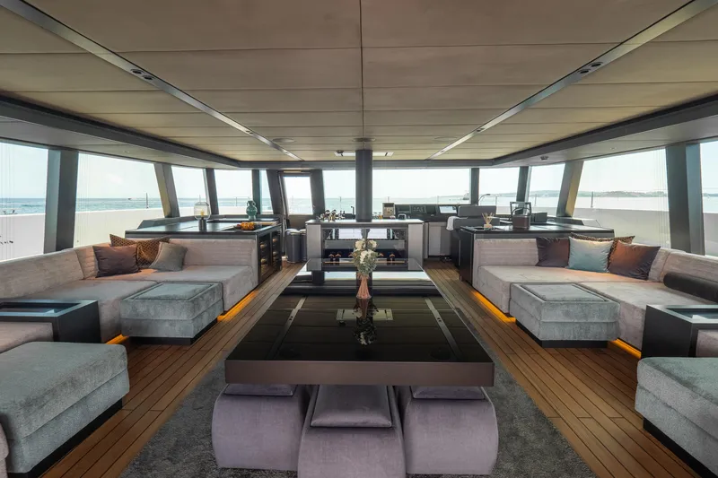 Shades Of Grey Yacht Photos Pics Luxurious interior of 2024 Sunreef 80 sailing yacht with modern furnishings and panoramic views.