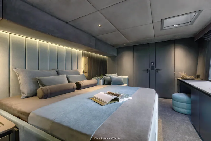 Shades Of Grey Yacht Photos Pics Luxurious bedroom interior of 2024 Sunreef 80 sailing yacht, featuring elegant design and modern amenities.