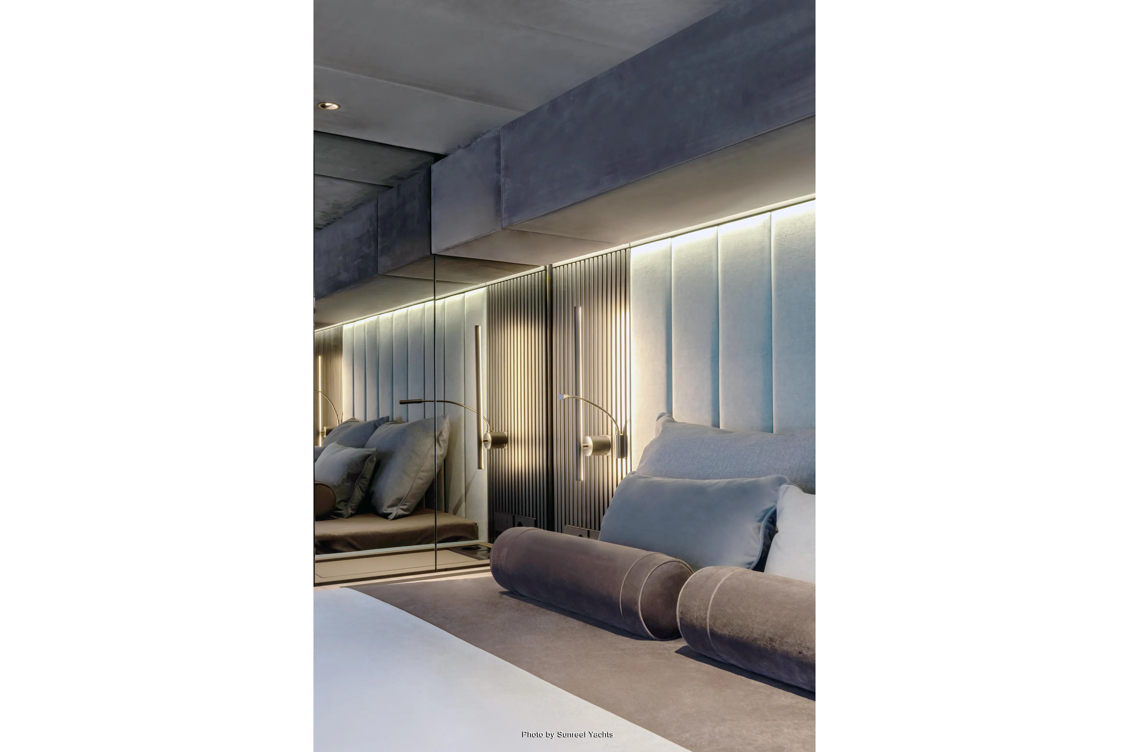 Shades Of Grey Yacht Photos Pics Luxurious interior of 2024 Sunreef 80 sailing yacht with elegant bedding and ambient lighting.