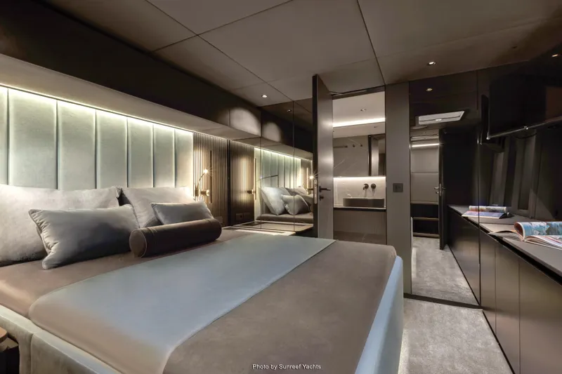 Shades Of Grey Yacht Photos Pics Luxurious bedroom interior of 2024 Sunreef 80 sailing yacht, featuring modern design and ambient lighting.