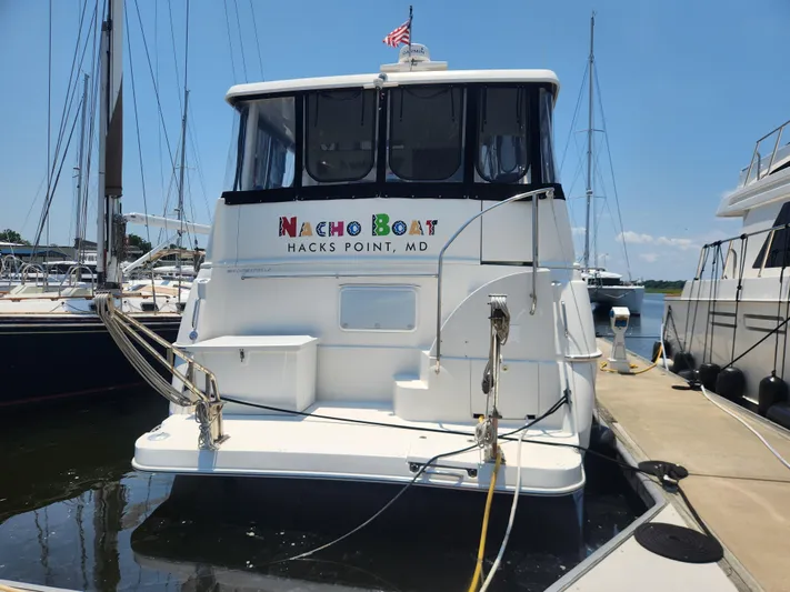 Nacho Boat Yacht Photos Pics 2000 Silverton 453 Motor Yacht docked at marina, labeled "Nacho Boat," Hacks Point, MD.