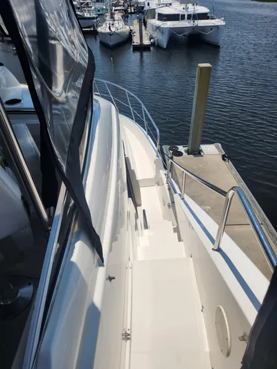 Nacho Boat Yacht Photos Pics 2000 Silverton 453 Motor Yacht docked at marina, view of deck and surrounding boats.