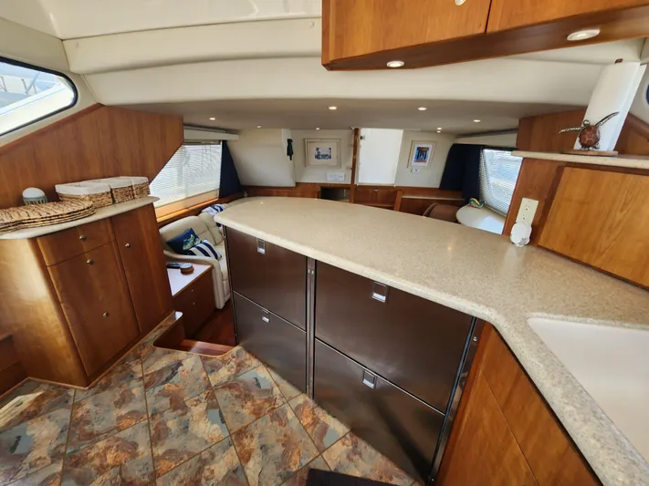Nacho Boat Yacht Photos Pics Interior of 2000 Silverton 453 Motor Yacht with modern kitchen and seating area.