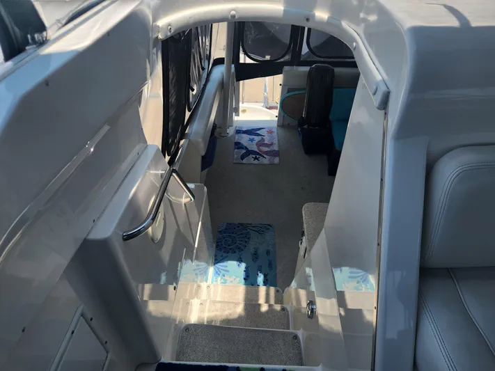 Nacho Boat Yacht Photos Pics Interior view of 2000 Silverton 453 Motor Yacht with carpeted steps and seating area.