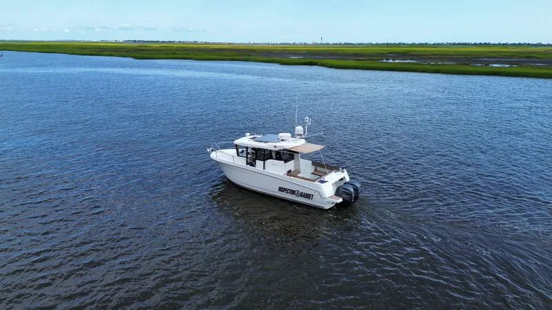 Inspector Gadget Yacht Photos Pics 2016 Jeanneau Merry Fisher 855 Marlin boat cruising on open water.