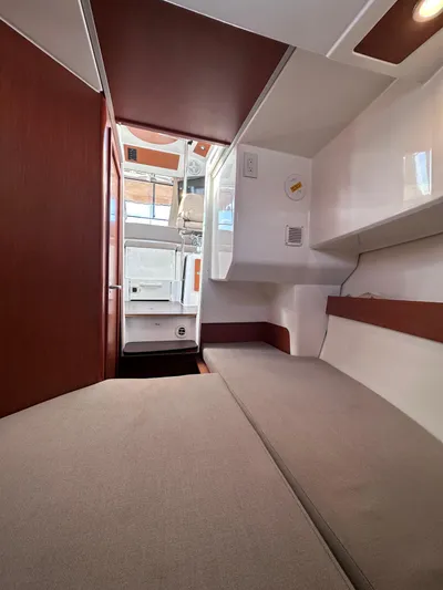 Inspector Gadget Yacht Photos Pics Interior cabin of 2016 Jeanneau Merry Fisher 855 Marlin, featuring cozy seating and modern design.