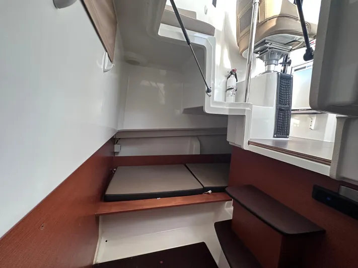 Inspector Gadget Yacht Photos Pics Interior cabin of 2016 Jeanneau Merry Fisher 855 Marlin with seating and stairs.