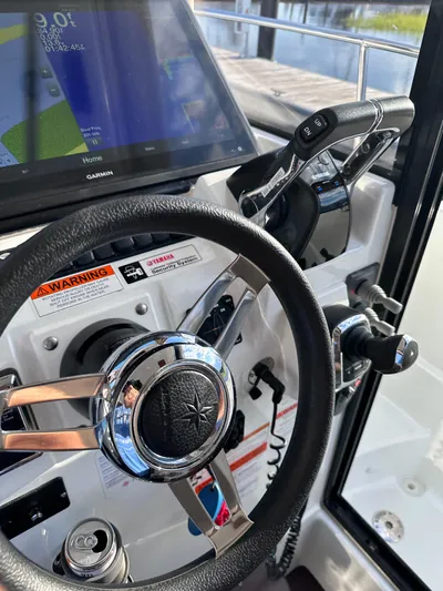 Inspector Gadget Yacht Photos Pics Helm of 2016 Jeanneau Merry Fisher 855 Marlin with Garmin navigation system.