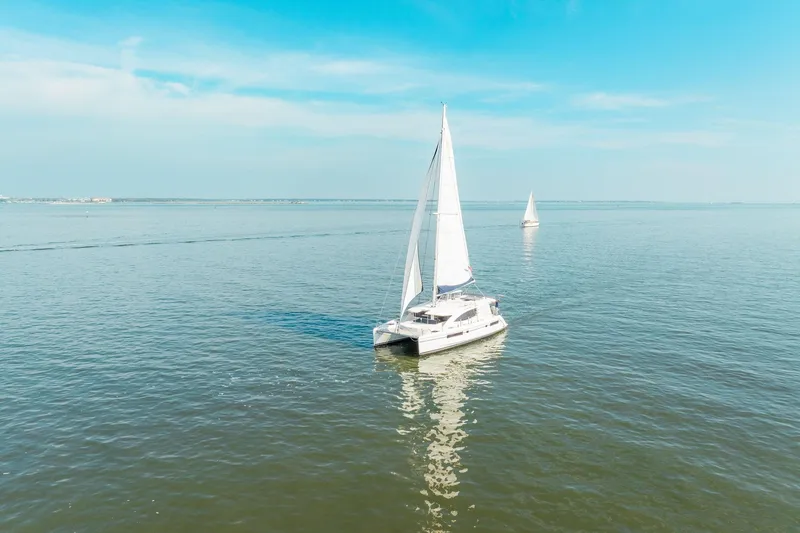 Grace Yacht Photos Pics Sailing catamaran Leopard 48, 2016 model, cruising on calm blue waters under clear skies.