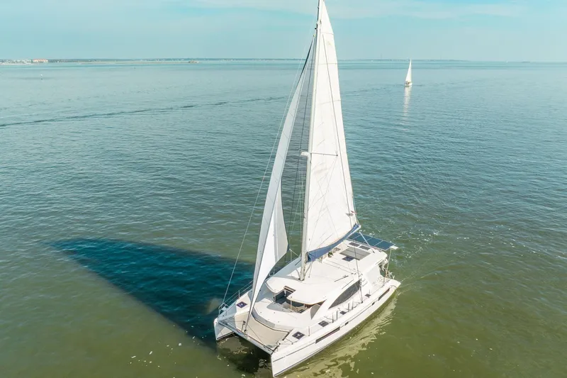 Grace Yacht Photos Pics Sailing catamaran Leopard 48, 2016 model, cruising on calm ocean waters.