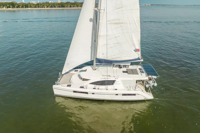 Grace Yacht Photos Pics 2016 Leopard 48 sailboat cruising on calm waters with full sails.