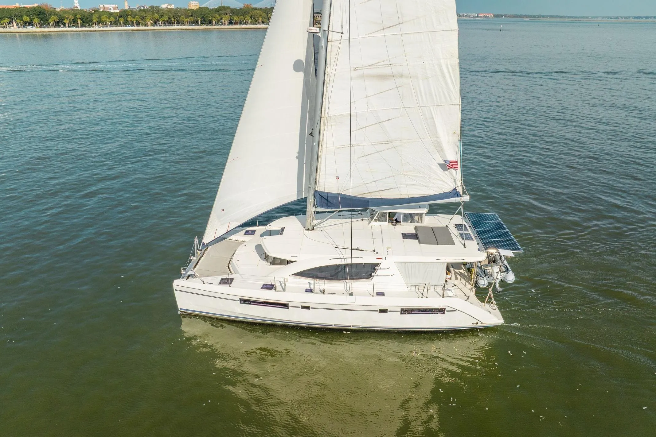 2016 Leopard 48 sailboat cruising on calm waters with full sails.