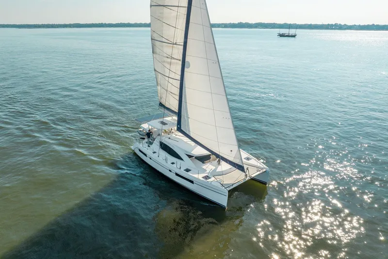 Grace Yacht Photos Pics 2016 Leopard 48 catamaran sailing on calm waters under clear skies.
