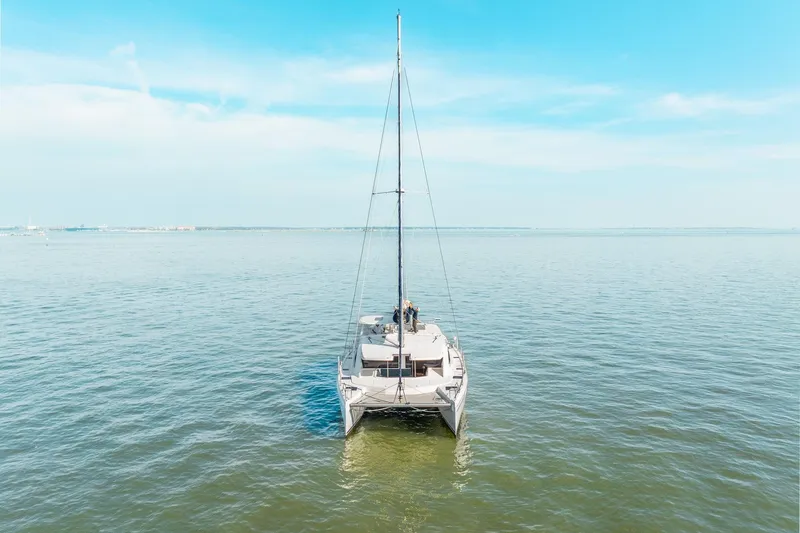 Grace Yacht Photos Pics 2016 Leopard 48 catamaran sailing on calm blue waters under a clear sky.