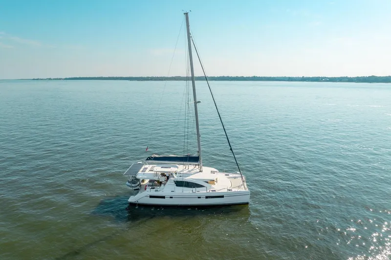 Grace Yacht Photos Pics 2016 Leopard 48 catamaran sailing on calm waters under a clear blue sky.
