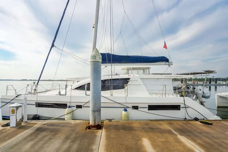 Grace Yacht Photos Pics 2016 Leopard 48 catamaran docked at marina with clear sky background.