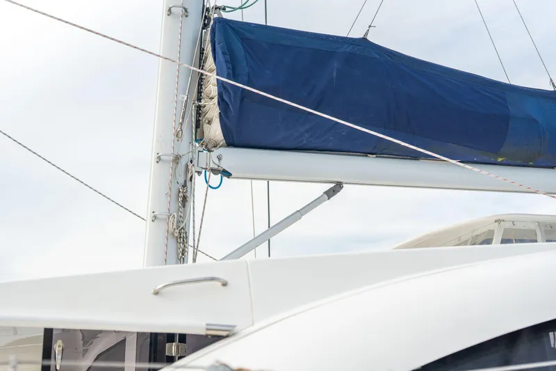 Grace Yacht Photos Pics Sailboat mast and boom with blue sail cover on 2016 Leopard 48 yacht.