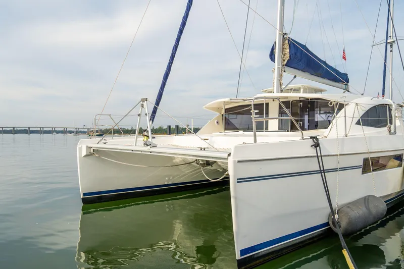 Grace Yacht Photos Pics 2016 Leopard 48 catamaran docked on calm water, featuring sleek design and spacious deck.