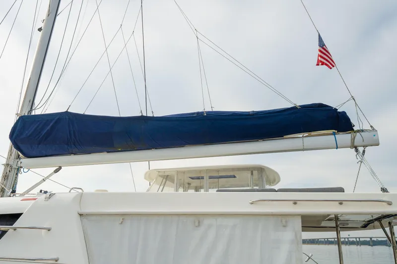 Grace Yacht Photos Pics 2016 Leopard 48 sailboat with covered boom and American flag.