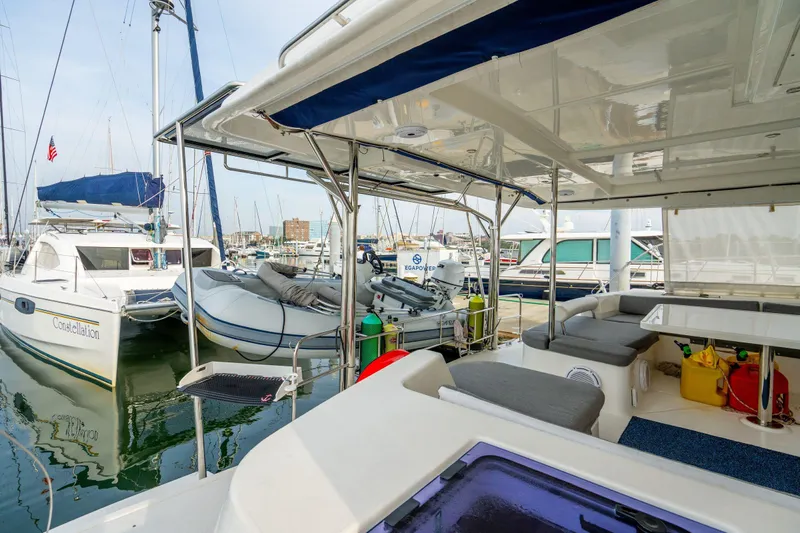 Grace Yacht Photos Pics Spacious deck of a 2016 Leopard 48 yacht docked at a marina.