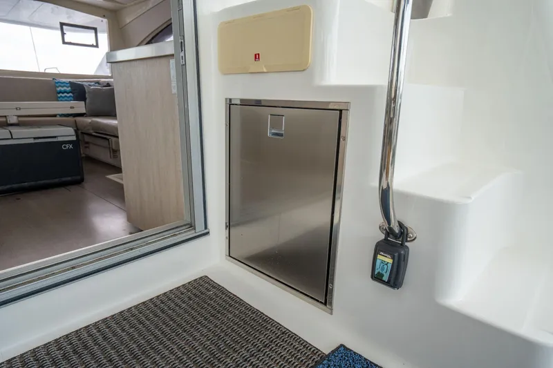 Grace Yacht Photos Pics Interior of 2016 Leopard 48 yacht, featuring stainless steel door and modern seating area.