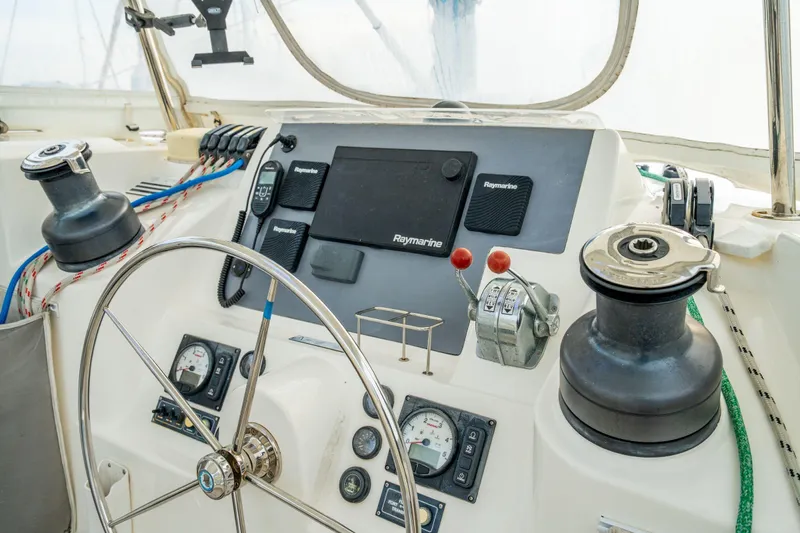 Grace Yacht Photos Pics Helm of 2016 Leopard 48 yacht with navigation instruments and steering wheel.