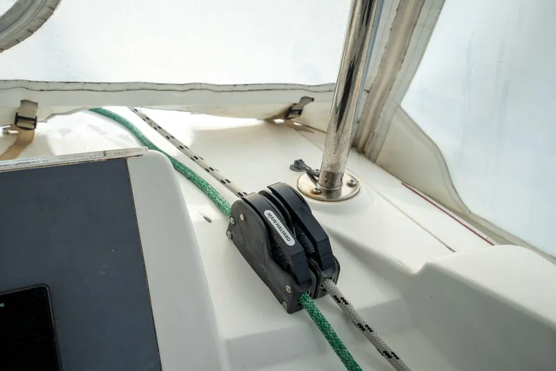 Grace Yacht Photos Pics Sailing equipment on a 2016 Leopard 48 yacht, featuring a rope clutch and lines.