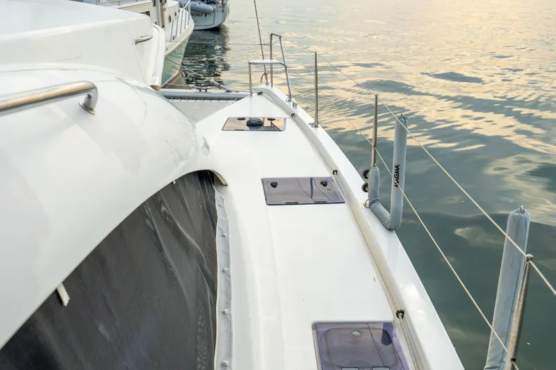 Grace Yacht Photos Pics Leopard 48 yacht deck, 2016 model, docked by calm waters at sunset.