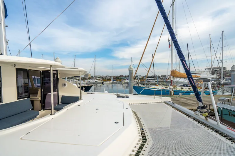 Grace Yacht Photos Pics Leopard 48 catamaran docked at marina, showcasing spacious deck and modern design.