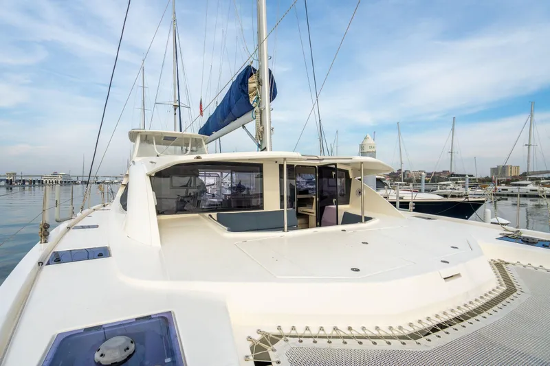 Grace Yacht Photos Pics 2016 Leopard 48 catamaran docked at marina, showcasing spacious deck and modern design.