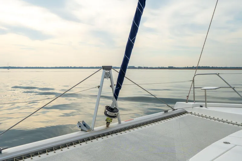 Grace Yacht Photos Pics Sailing on a 2016 Leopard 48 catamaran, calm waters, and serene sky.