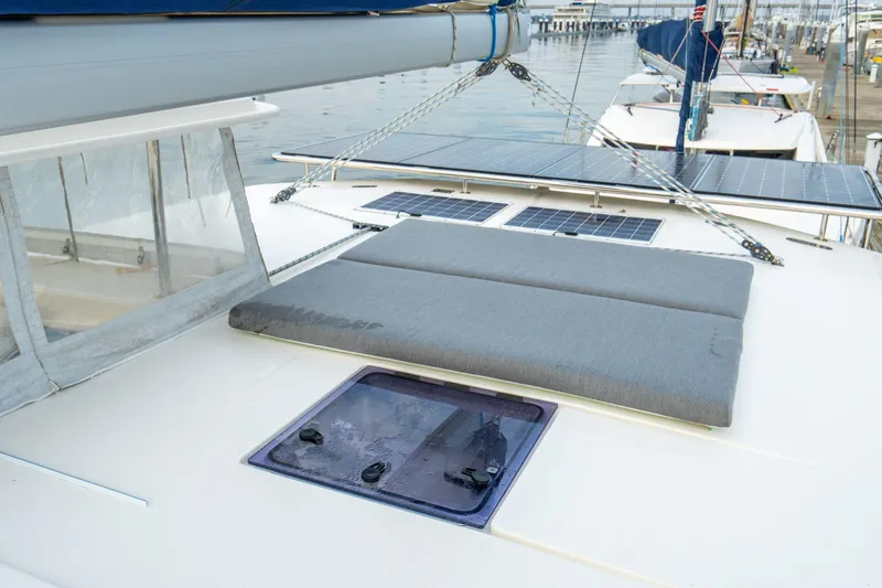 Grace Yacht Photos Pics 2016 Leopard 48 yacht deck with solar panels and cushioned seating.