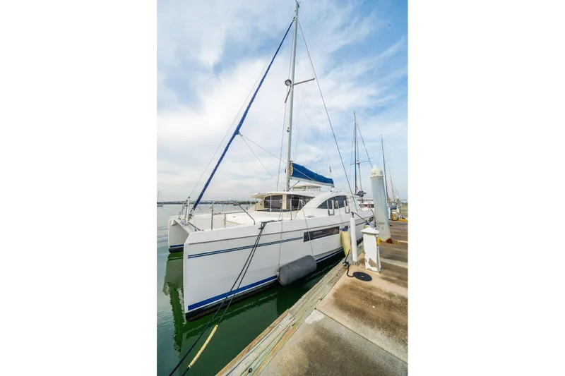 Grace Yacht Photos Pics 2016 Leopard 48 catamaran docked at marina under clear sky.