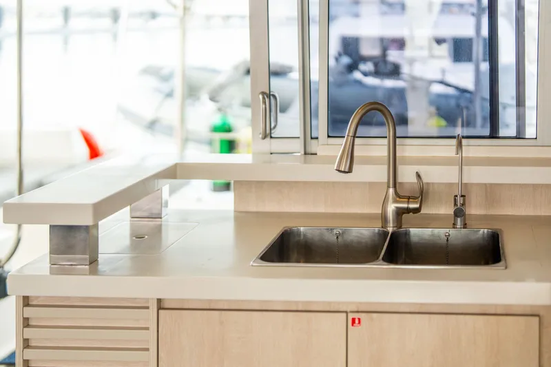 Grace Yacht Photos Pics Modern kitchen sink on 2016 Leopard 48 yacht with stainless steel fixtures.