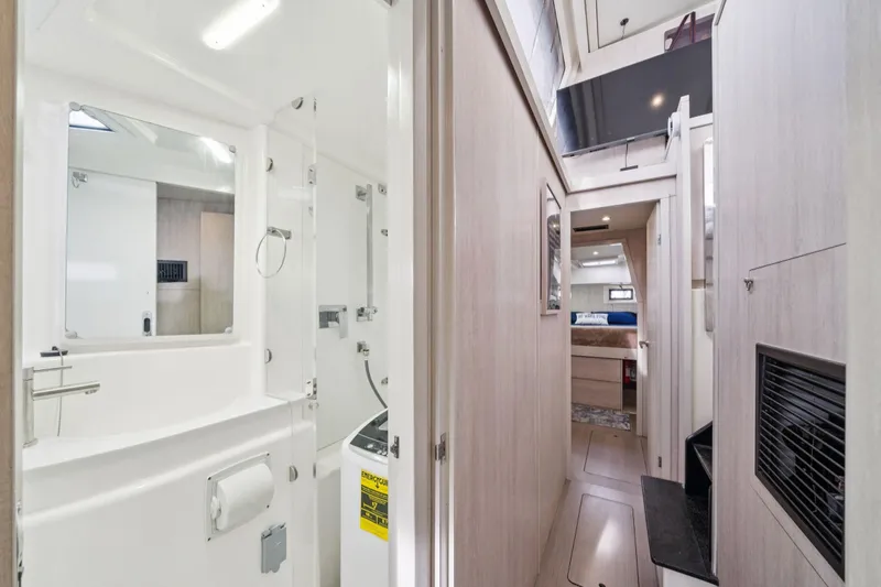 Grace Yacht Photos Pics Luxurious interior of 2016 Leopard 48 yacht featuring modern bathroom and cozy cabin.