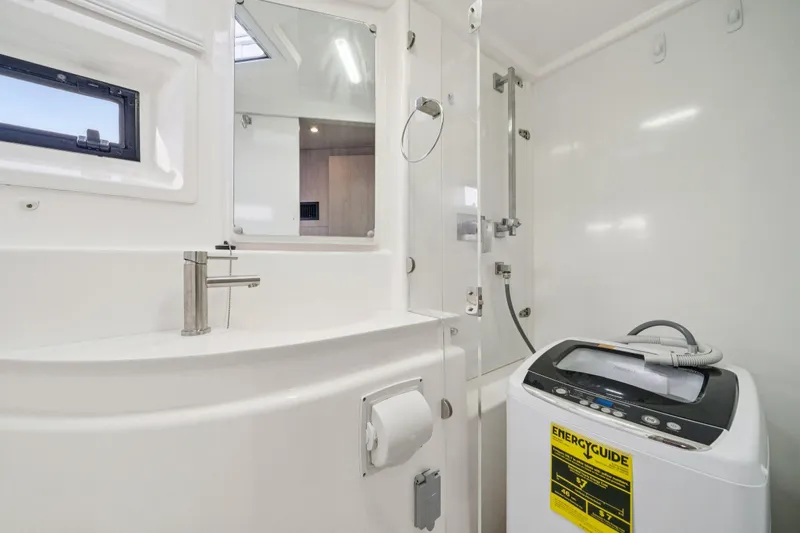 Grace Yacht Photos Pics Modern bathroom in 2016 Leopard 48 yacht with washing machine and shower.