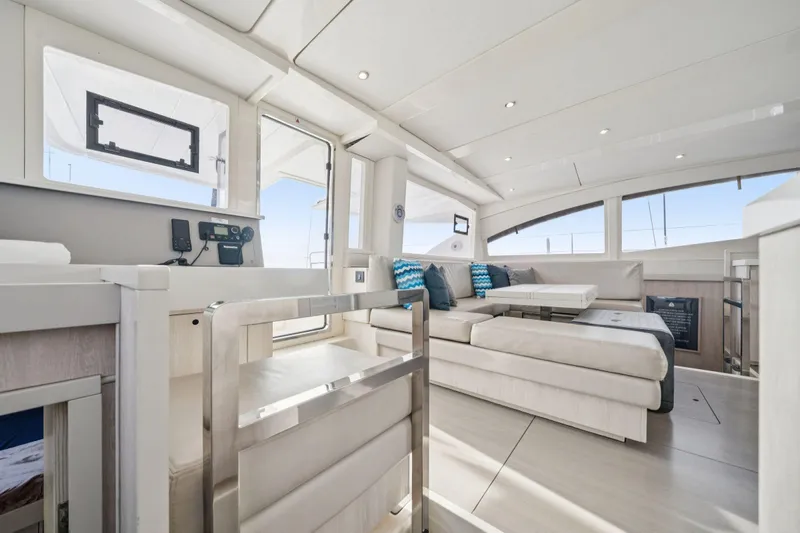 Grace Yacht Photos Pics Luxurious interior of 2016 Leopard 48 yacht with modern seating and panoramic windows.