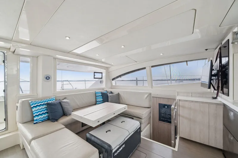 Grace Yacht Photos Pics Luxurious interior of 2016 Leopard 48 yacht with modern seating and ocean view.