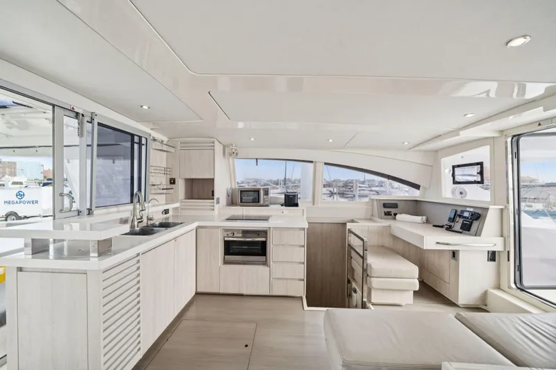Grace Yacht Photos Pics Luxurious interior of 2016 Leopard 48 yacht with modern kitchen and navigation area.