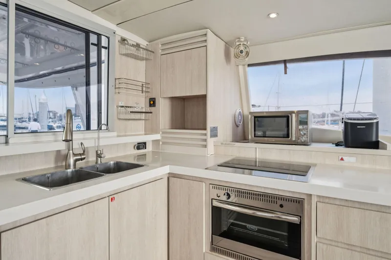 Grace Yacht Photos Pics Modern kitchen interior on 2016 Leopard 48 yacht with appliances and sleek design.