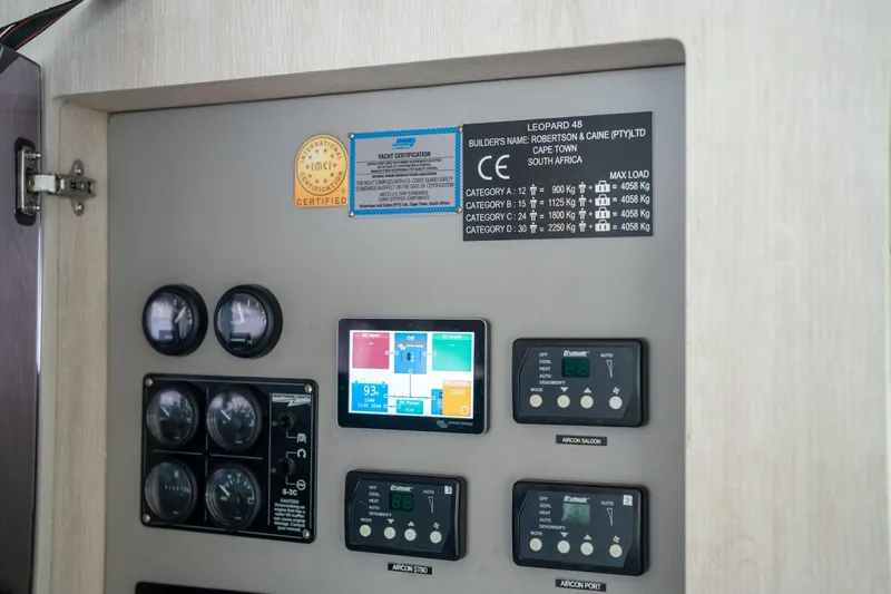Grace Yacht Photos Pics Control panel of a 2016 Leopard 48 yacht with gauges and certification labels.
