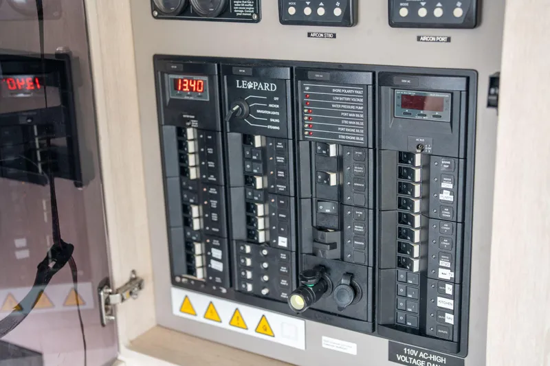 Grace Yacht Photos Pics Electrical control panel of a 2016 Leopard 48 yacht, featuring various switches and indicators.