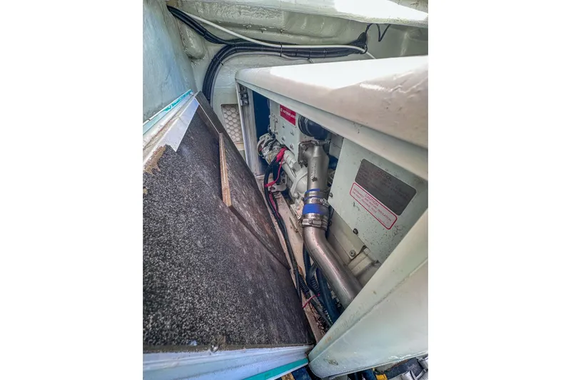 Grace Yacht Photos Pics Engine compartment of a 2016 Leopard 48 yacht, showcasing mechanical components and wiring.