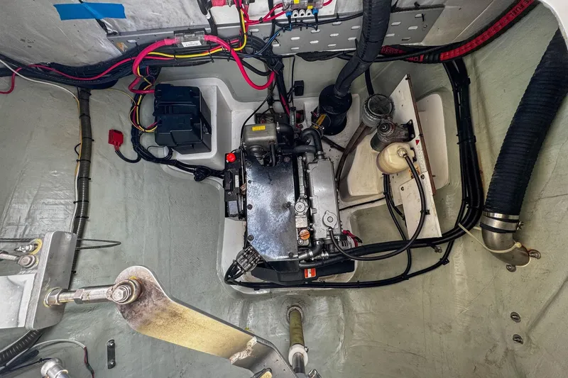 Grace Yacht Photos Pics Engine compartment of a 2016 Leopard 48 yacht, showcasing wiring and mechanical components.